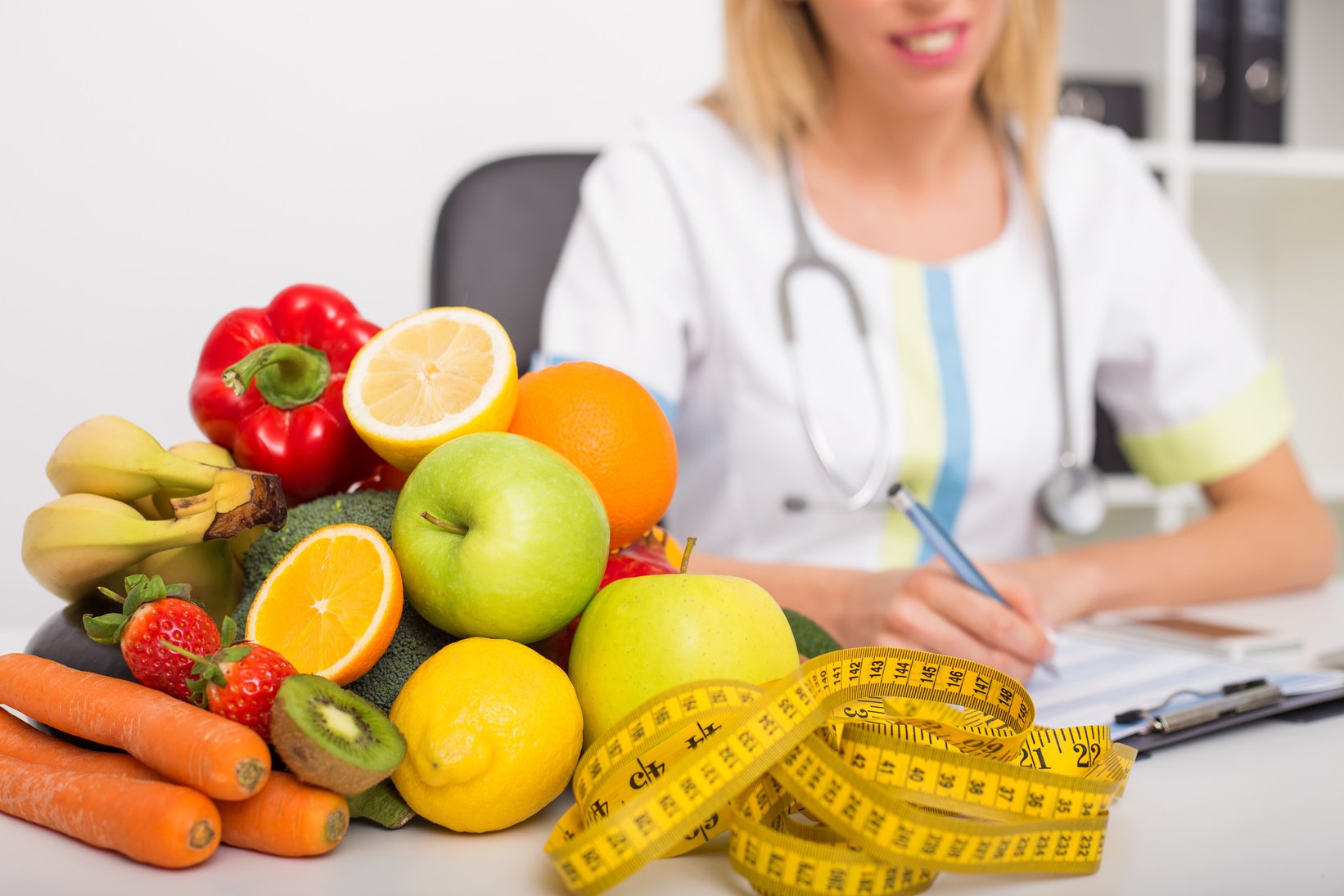 Health coach office with vegetables and tape measure